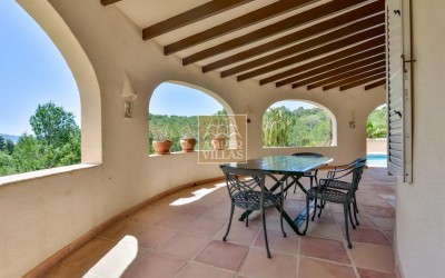 A beautiful villa in a peaceful, green setting.
